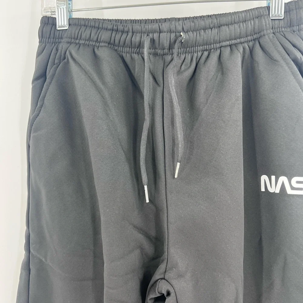 SHEIN MEN’s NASA joggers are fleece-lined. Medium